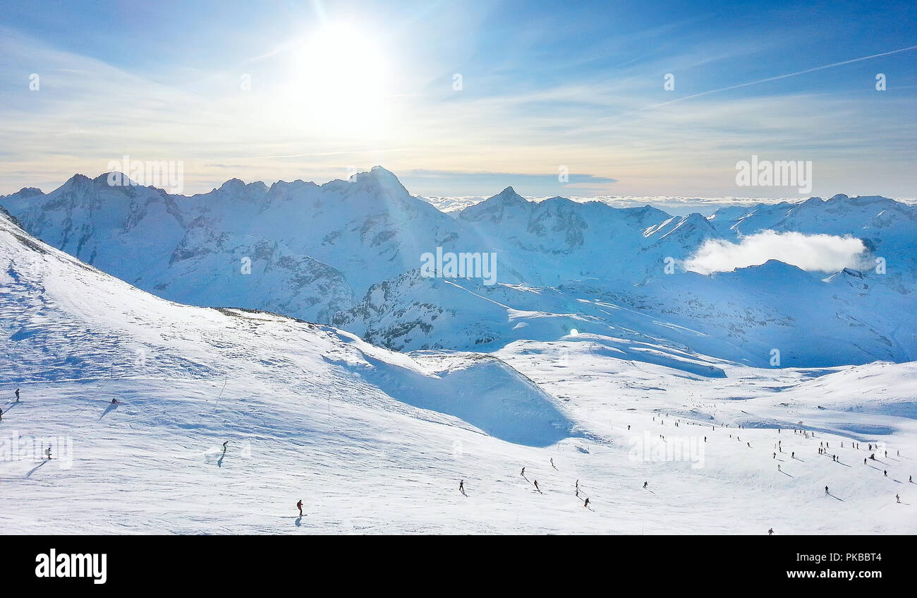 ski resort slopes, mountain panorama and sun aerial view, France, French Alps Stock Photo