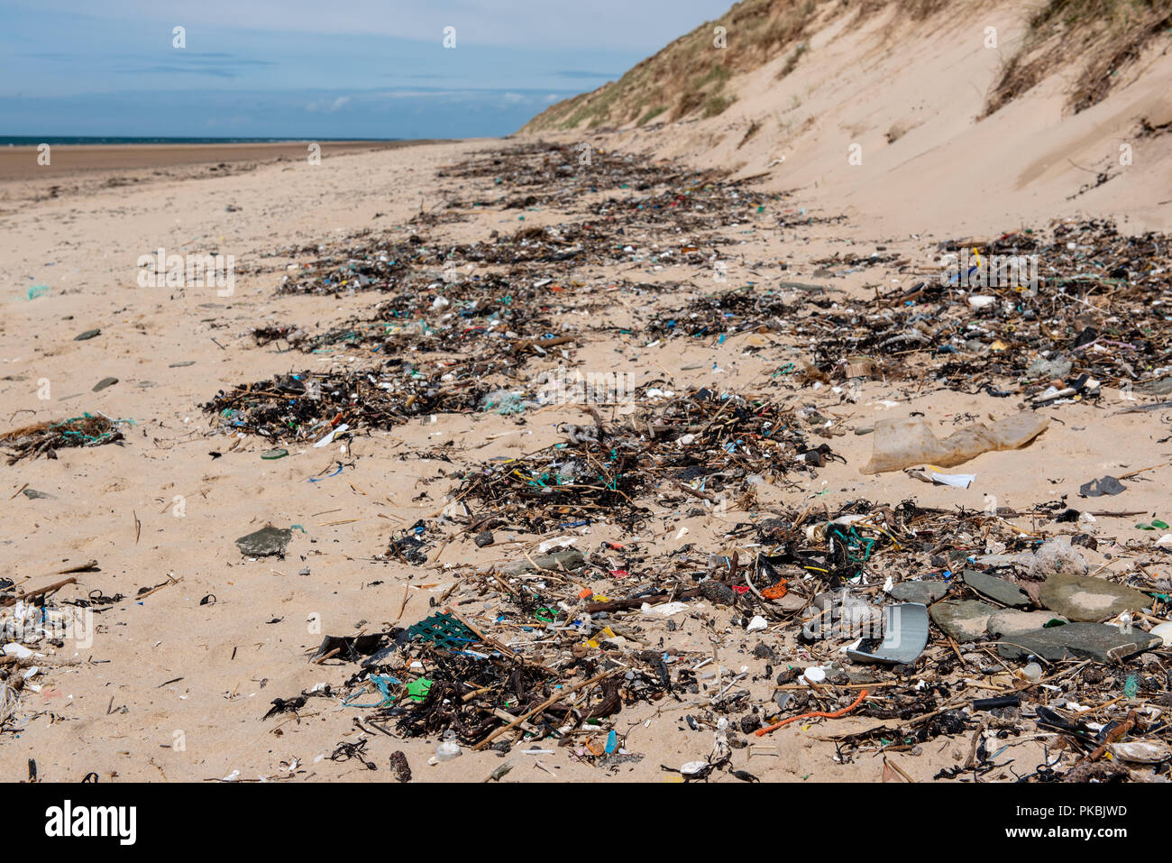 Plastic waste washed up on a beach Stock Photo - Alamy