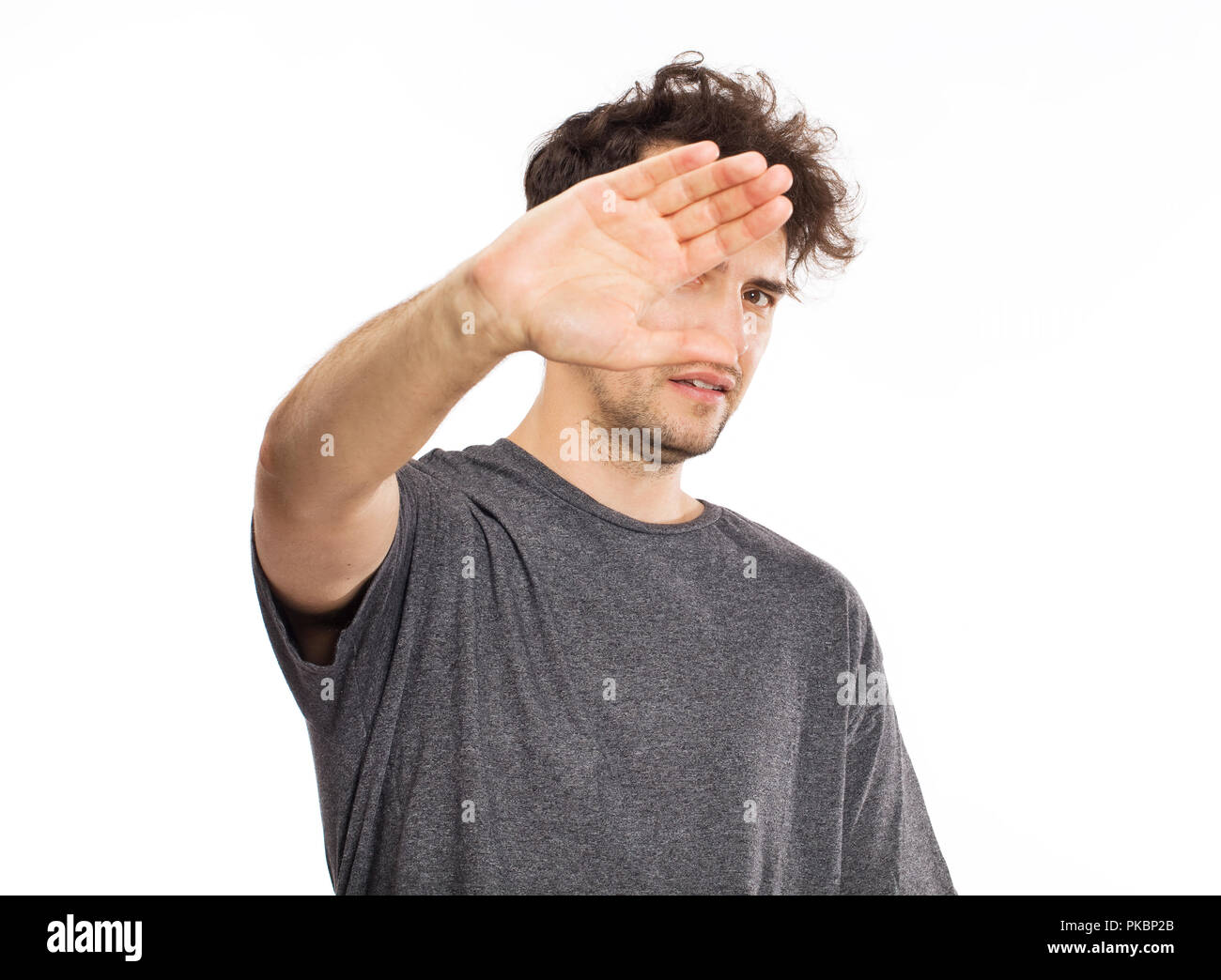 Male protecting face from violence attack Stock Photo