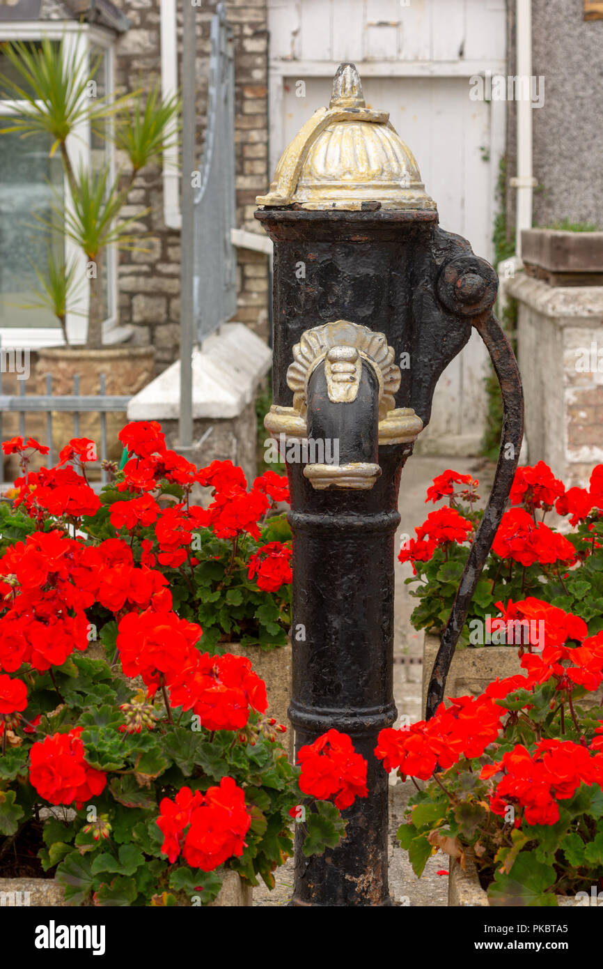 Antique water pump in a Pentewan street, St Austell, South Cornwall