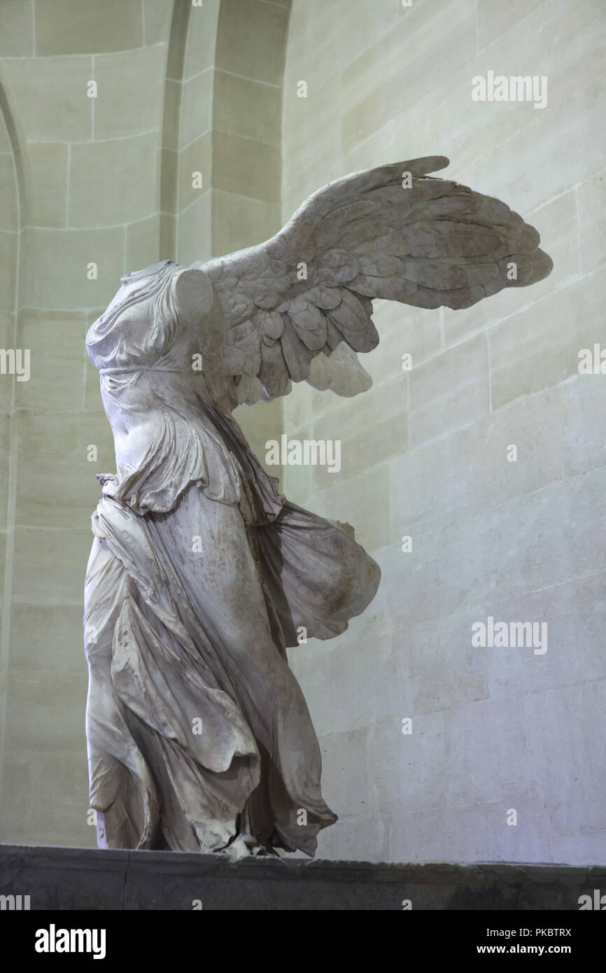Hellenistic marble statue known as the Winged Nike of Samothrace dated from the 2nd century BC on display in the Louvre Museum in Paris, France. Stock Photo