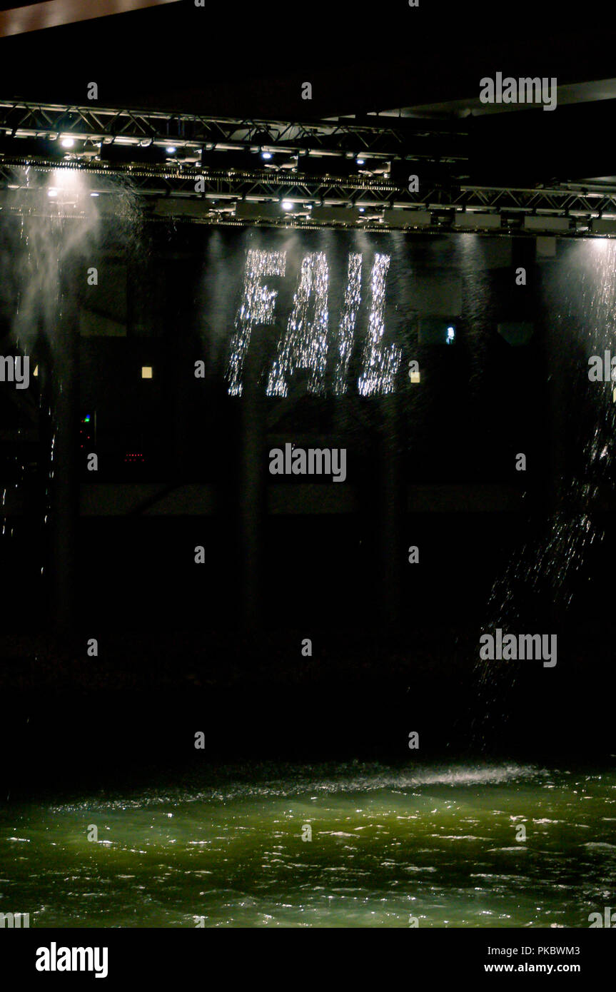 The word 'fail' written in falling water at night at the London Olympic Park 2012, England, UK Stock Photo