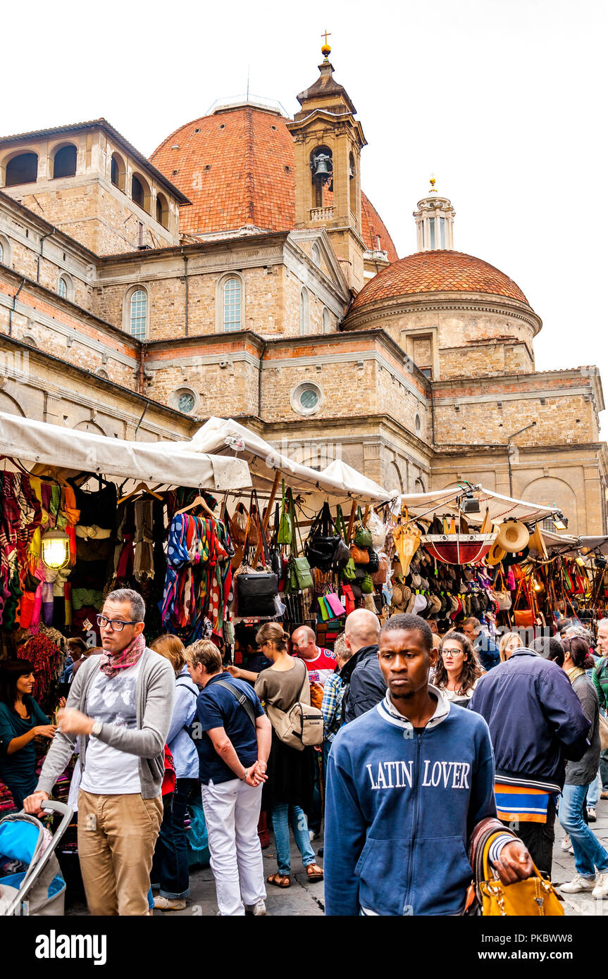 The Basilica di San Lorenzo, with a market and people 'Latin Lover' in the foreground, Florence (Firenze), Italy Stock Photo