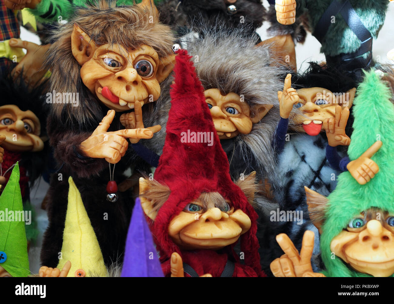 A bunch of different colorful little cute trolls Stock Photo