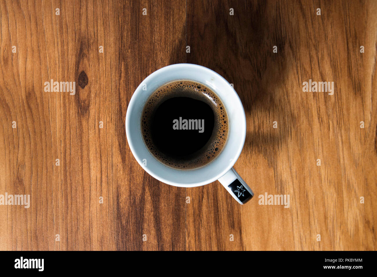 Coffee cup on the old wooden table Stock Photo