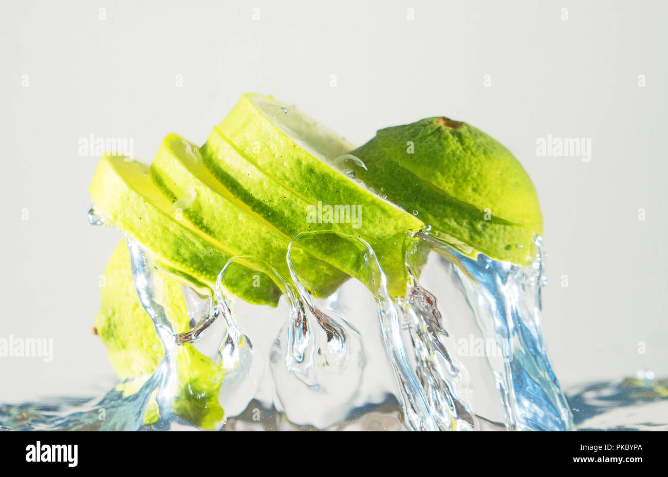 Fresh lime coming out from water. Suitable for advertisement. Stock Photo