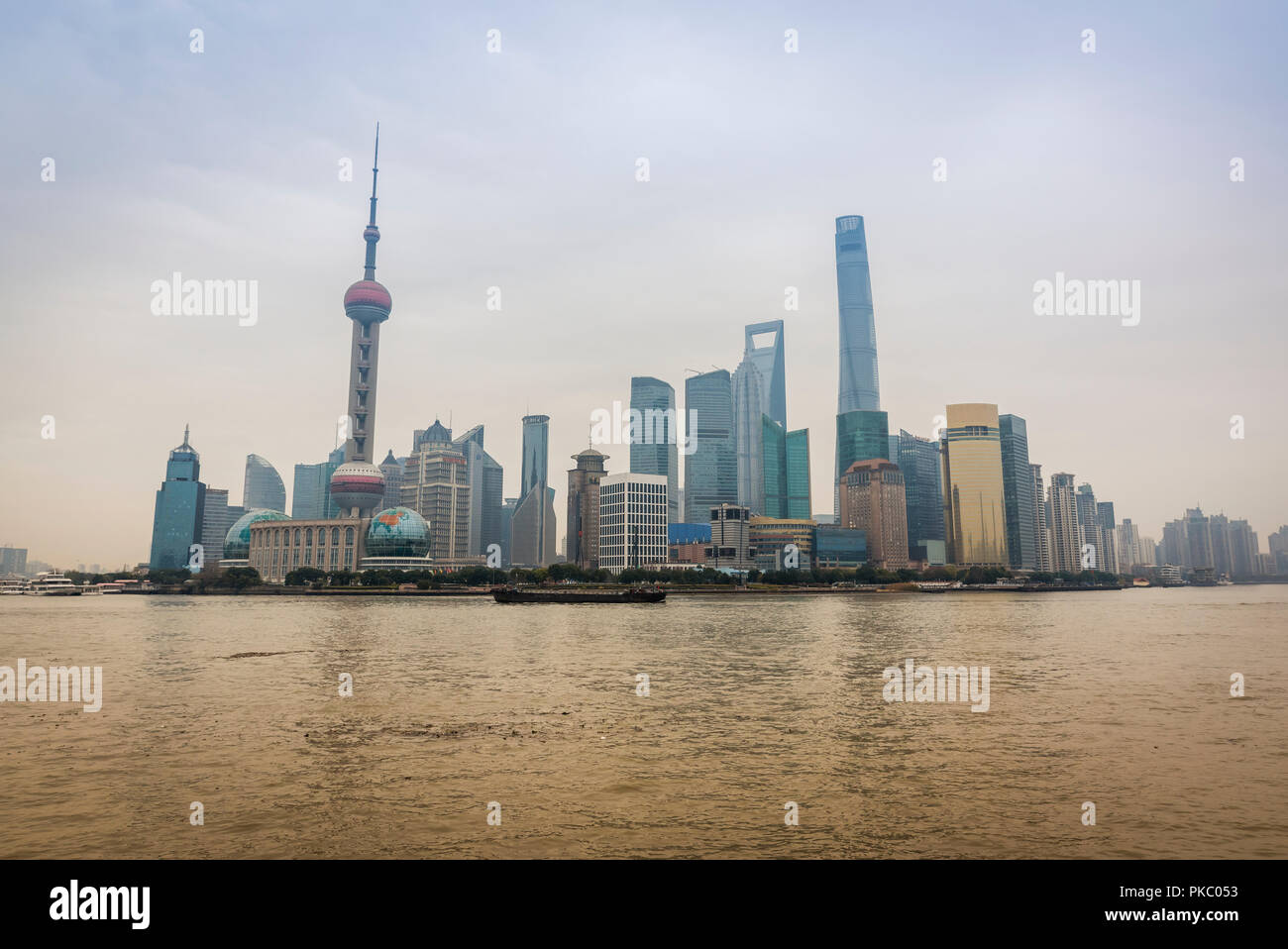Pudong skyline with its landmark skyscrapers seen from the opposite side of the Huangpu river; Shanghai, China Stock Photo
