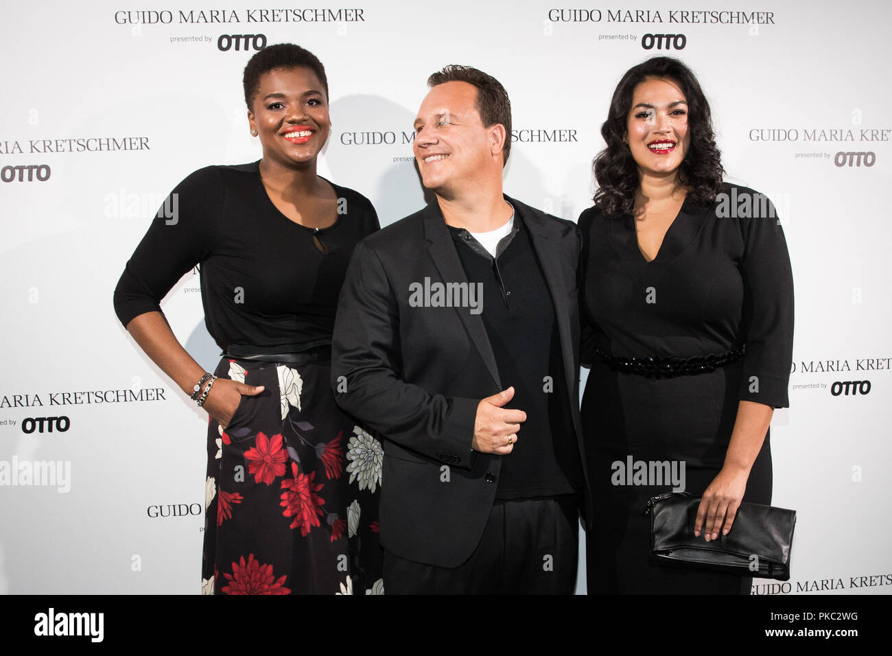 11 September 2018, Hamburg: Designer Guido Maria Kretschmer (M) and two  models present pieces from his "Curvy Collection". Under the motto "Size  Revolution", the designer presents his new "Curvy Collection presented by