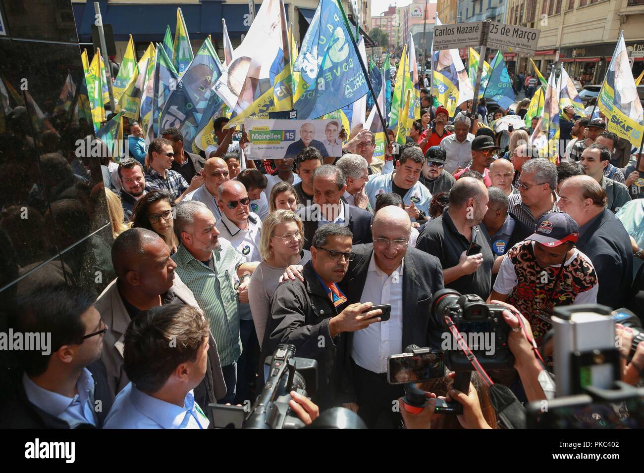 Sao Paulo, Brazil. 12th Sep, 2018. the candidate for the presidency of the republic of Brazil Henrique Meirelles (C) does a campaign walk in the popular commerce region on March 25th Street in Sao Paulo on September 12, 2018 Credit: Dario Oliveira/ZUMA Wire/Alamy Live News Stock Photo