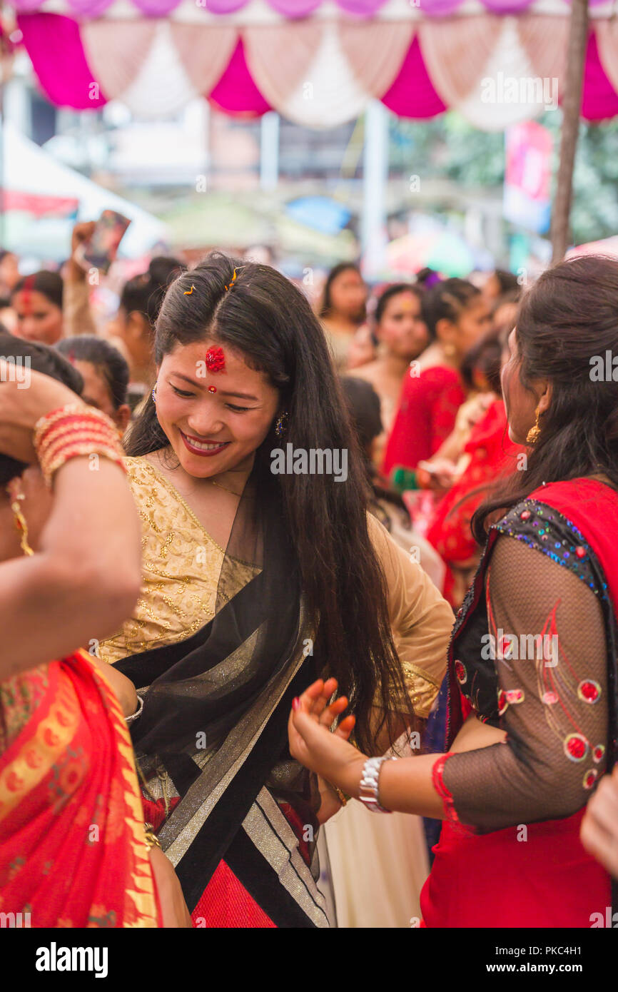 Kathmandu,Nepal - Sep 12,2018: Nepali Hindu Women Dancing at Teej Festival in Kathmandu.Hindu Nepali Women fast and wish for a prosperous life of their spouse and family on this festival.The festivals for women, include dancing, singing, getting together with friends,, wearing red, green or orange clothes, sharing festive foods Credit: Nabaraj Regmi/Alamy Live News Stock Photo