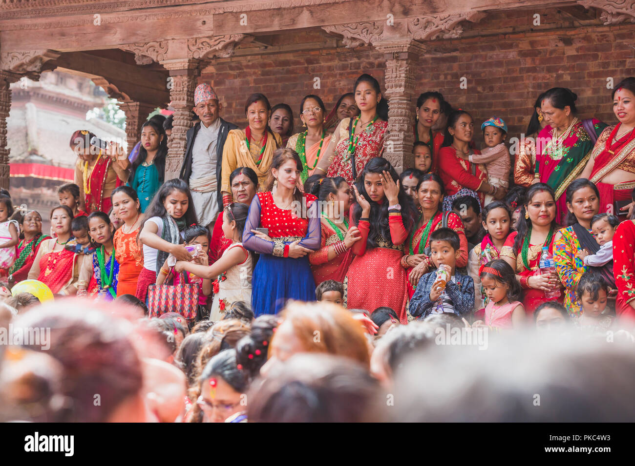Kathmandu,Nepal - Sep 12,2018: Hindu Nepali Women at Kathmandu Durbar Square to celebrate Teej Festival in Kathmandu.Hindu Nepali Women fast and wish for a prosperous life of their spouse and family on this festival.The festivals for women, include dancing, singing, getting together with friends,, wearing red, green or orange clothes, sharing festive foods Credit: Nabaraj Regmi/Alamy Live News Stock Photo