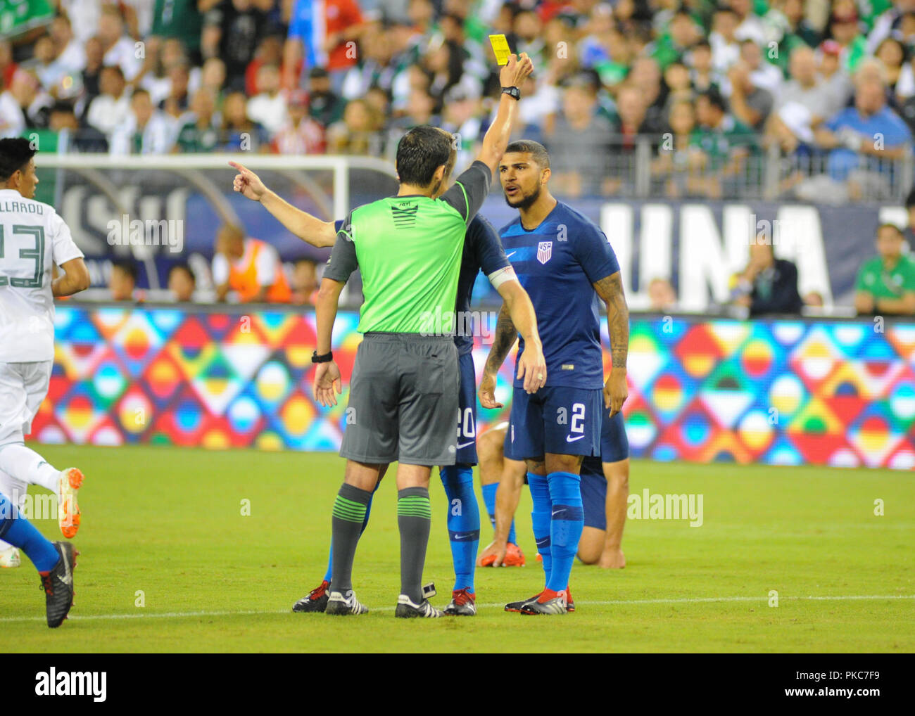 Nashville, TN, USA. 11th Sep, 2018. US defender, DeAndre Yedlin (2), argues with the referee after receiving a yellow card during the International Friendly match between Mexico and USA at Nissan Stadium in Nashville, TN. The US National team defeated Mexico, 1-0. Kevin Langley/CSM/Alamy Live News Stock Photo