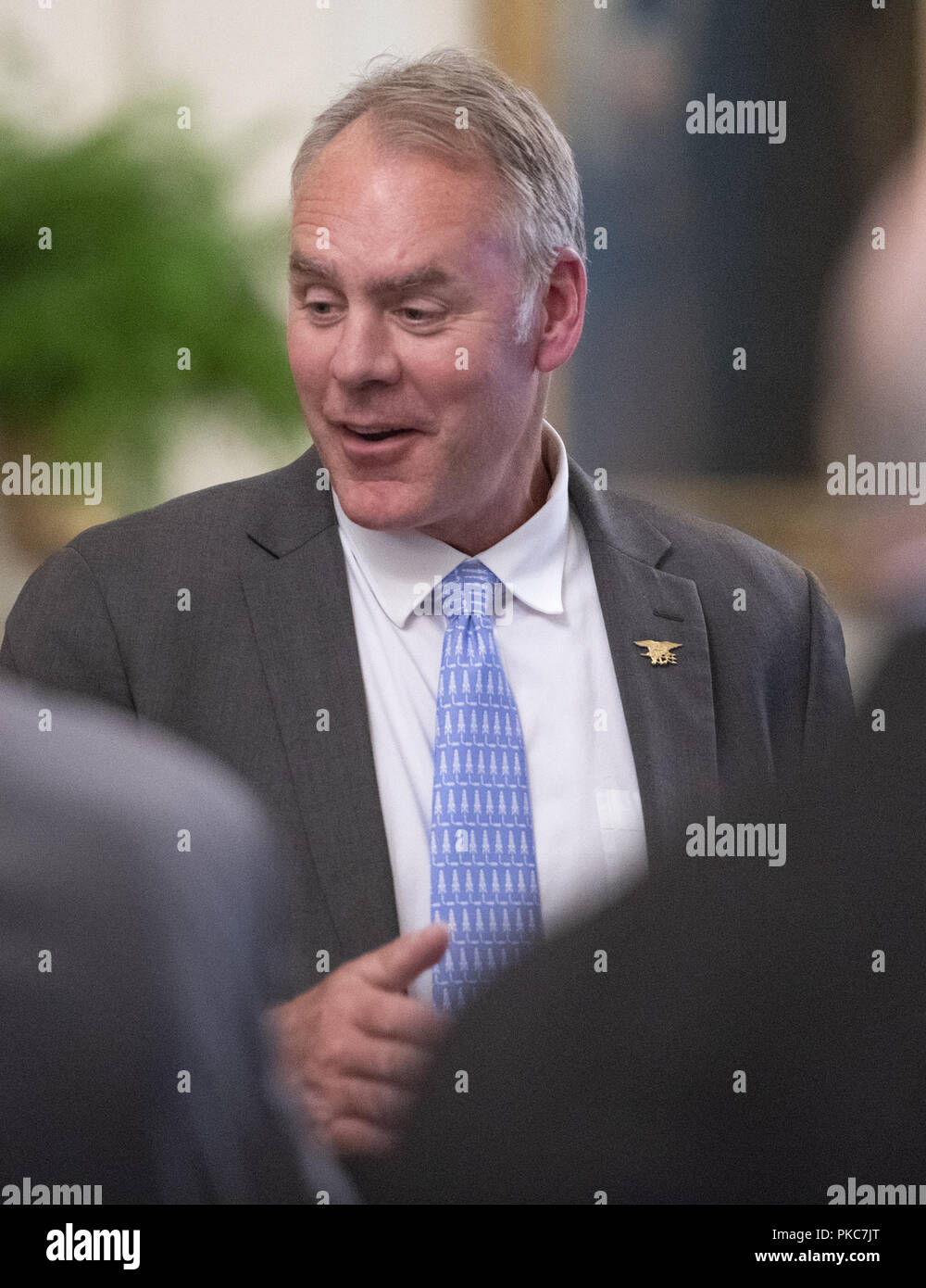 Washington, District of Columbia, USA. 12th Sep, 2018. United States Secretary of Interior Ryan Zinke in conversation prior to the arrival of US President Donald J. Trump who will make remarks at the Congressional Medal of Honor Society Reception in the East Room of the White House in Washington, DC on Wednesday, September 12, 2018 Credit: Ron Sachs/CNP/ZUMA Wire/Alamy Live News Stock Photo