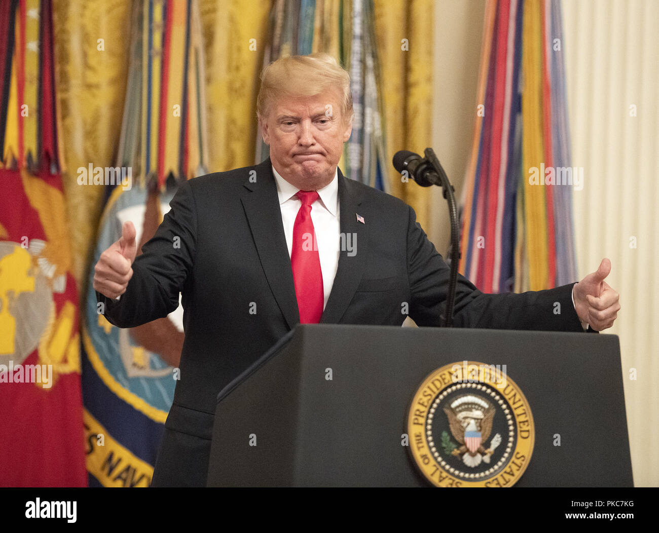 Washington, District of Columbia, USA. 12th Sep, 2018. United States President Donald J. Trump concludes his remarks at the Congressional Medal of Honor Society Reception in the East Room of the White House in Washington, DC on Wednesday, September 12, 2018 Credit: Ron Sachs/CNP/ZUMA Wire/Alamy Live News Stock Photo