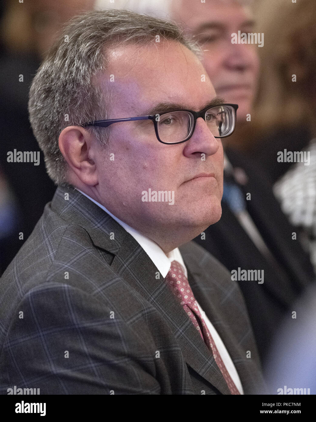 Washington, District of Columbia, USA. 12th Sep, 2018. Acting Environmental Protection Agency Administrator Andrew Wheeler listens as United States President Donald J. Trump makes remarks at the Congressional Medal of Honor Society Reception in the East Room of the White House in Washington, DC on Wednesday, September 12, 2018 Credit: Ron Sachs/CNP/ZUMA Wire/Alamy Live News Stock Photo
