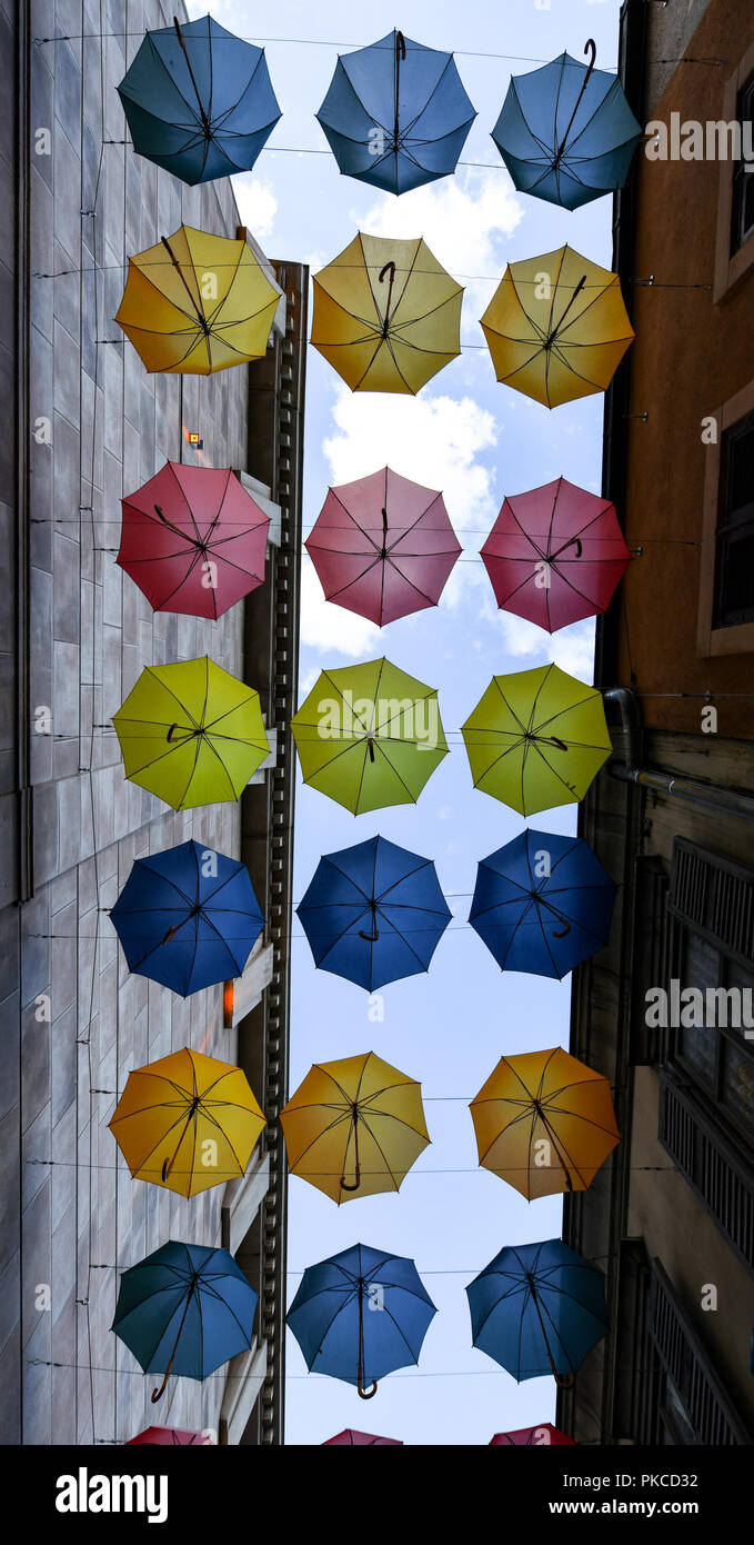 12 September 2018, Baden-Wuerttemberg, Rust: Umbrellas hang between two  house walls in Europa-Park. For Thursday (13.09.2018) the meteorologists  predict rain. Photo: Patrick Seeger/dpa Stock Photo - Alamy