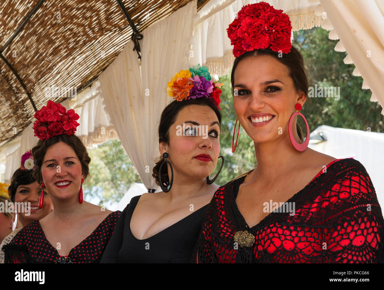 Women wearing colourful gypsy dresses, Pentecost pilgrimage of El Rocio
