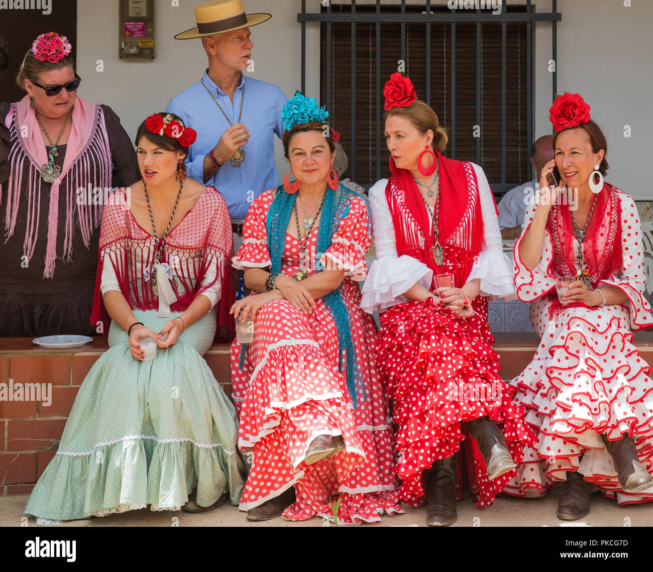 Women wearing colourful gypsy dresses, Pentecost pilgrimage of El Rocio,  Huelva province, Andalusia, Spain Stock Photo - Alamy