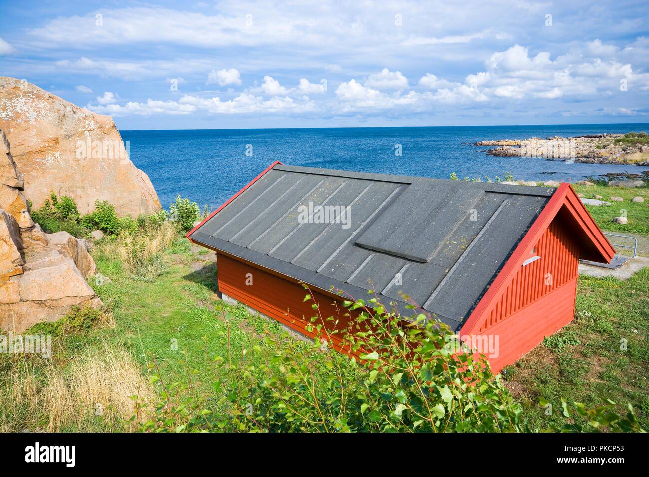 Small wooden cottage at the seaside, Sandvig, Bornholm, Denmark Stock