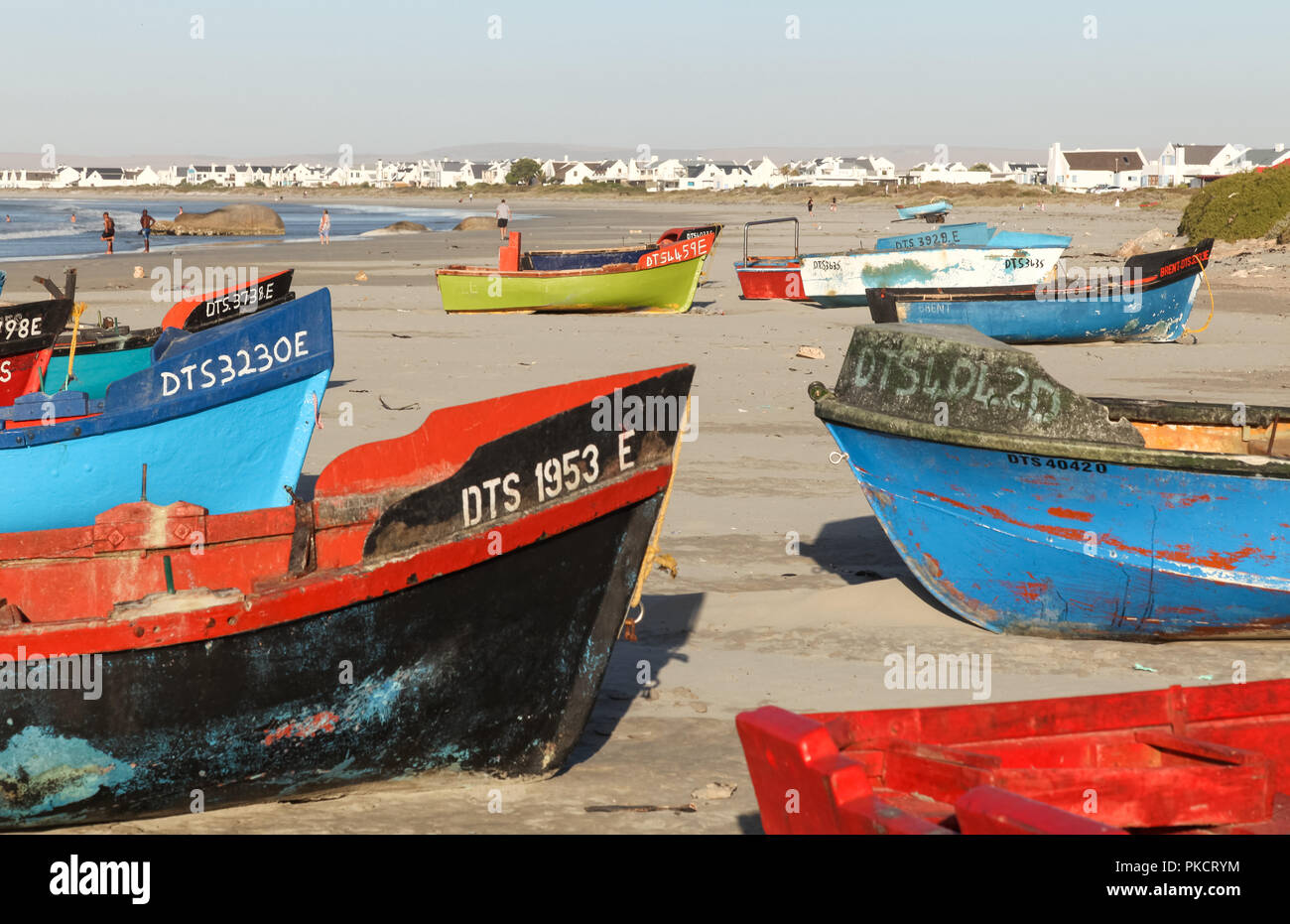 Colourful fishing boats on beach at Paternoster, small fishing village with gourmet restaurants on west coast of South Africa in Western Cape. Stock Photo