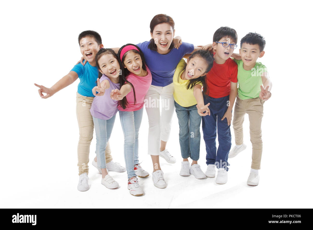 Primary school students and the female teacher together Stock Photo