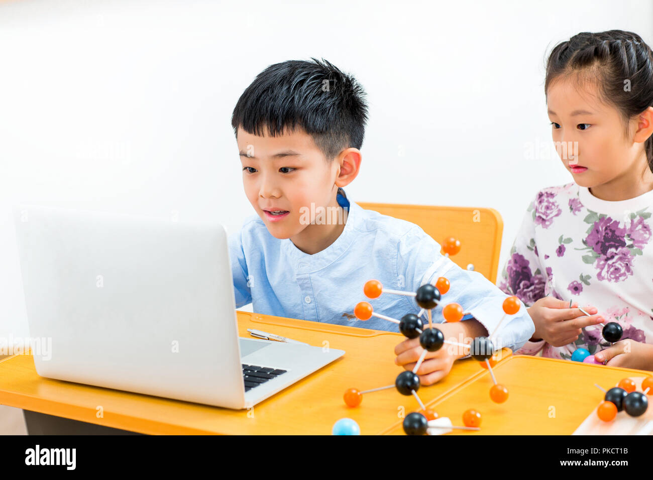 Elementary school students use computers in the classroom Stock Photo ...