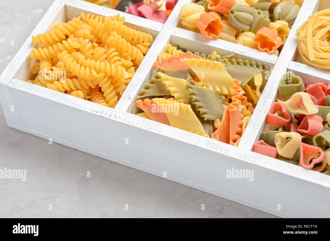 Variety of types and shapes of raw Italian pasta. Stock Photo