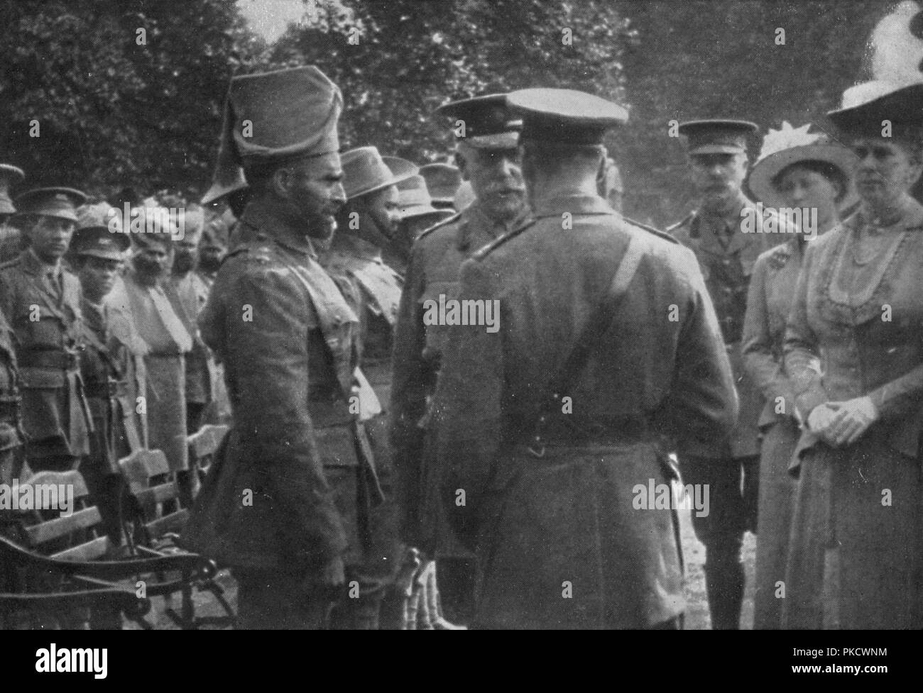 'H.M. King George V Talking To Sir Walter Lawrence and Mir Dast, V.C., 25th August 1915', (1939). Artist: Unknown. Stock Photo