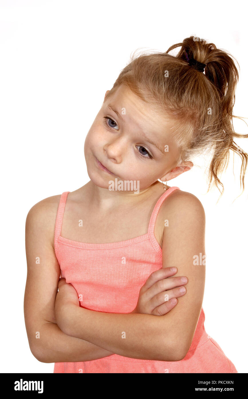 Six year old girl with quizzical, bored or wry smile look Stock Photo
