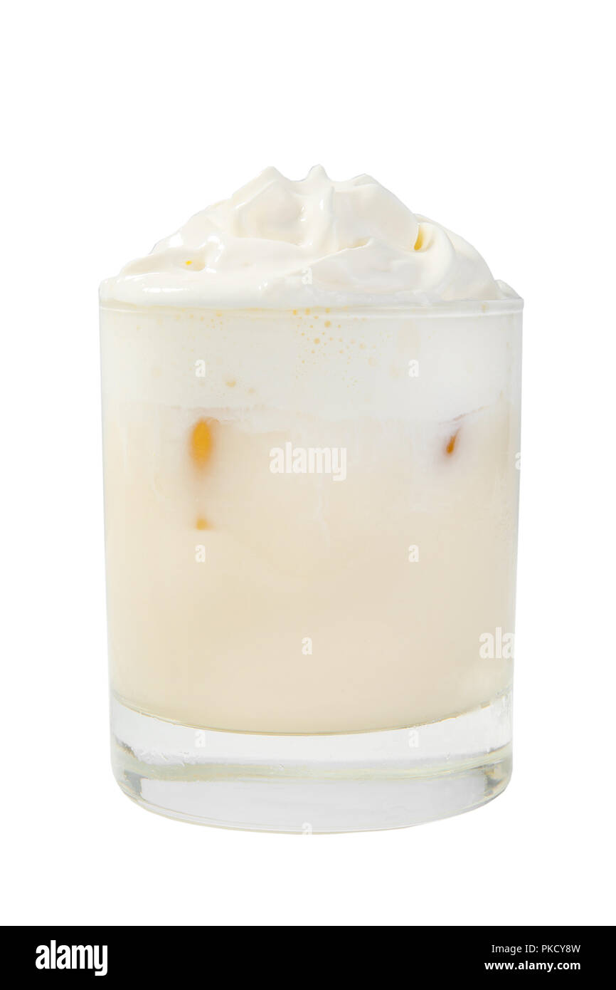 Single-color opaque creamy, milkshake in a low glass, with whipped ...