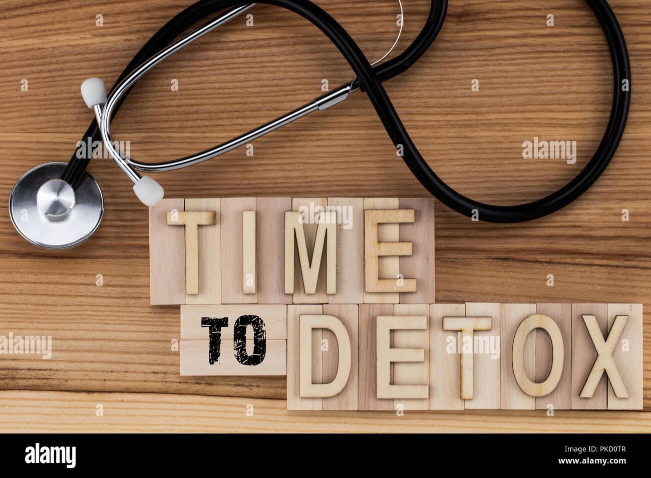 Time to Detox -  text in vintage letters on wooden blocks with stethoscope. Stock Photo