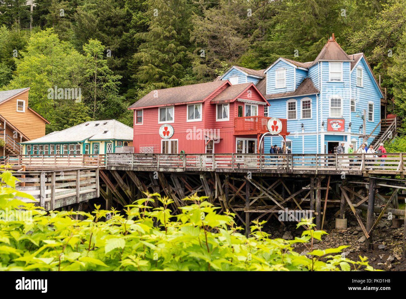 Some of the old timber houses in Creek Street built on stilts above the Ketchikan Creek in downtown Ketchikan, Alaska USA Stock Photo