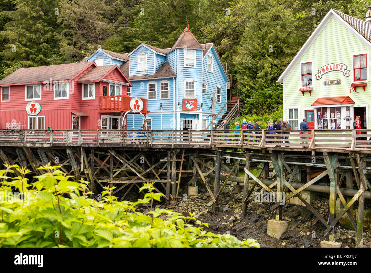 Some of the old timber houses in Creek Street built on stilts above the Ketchikan Creek in downtown Ketchikan, Alaska USA Stock Photo