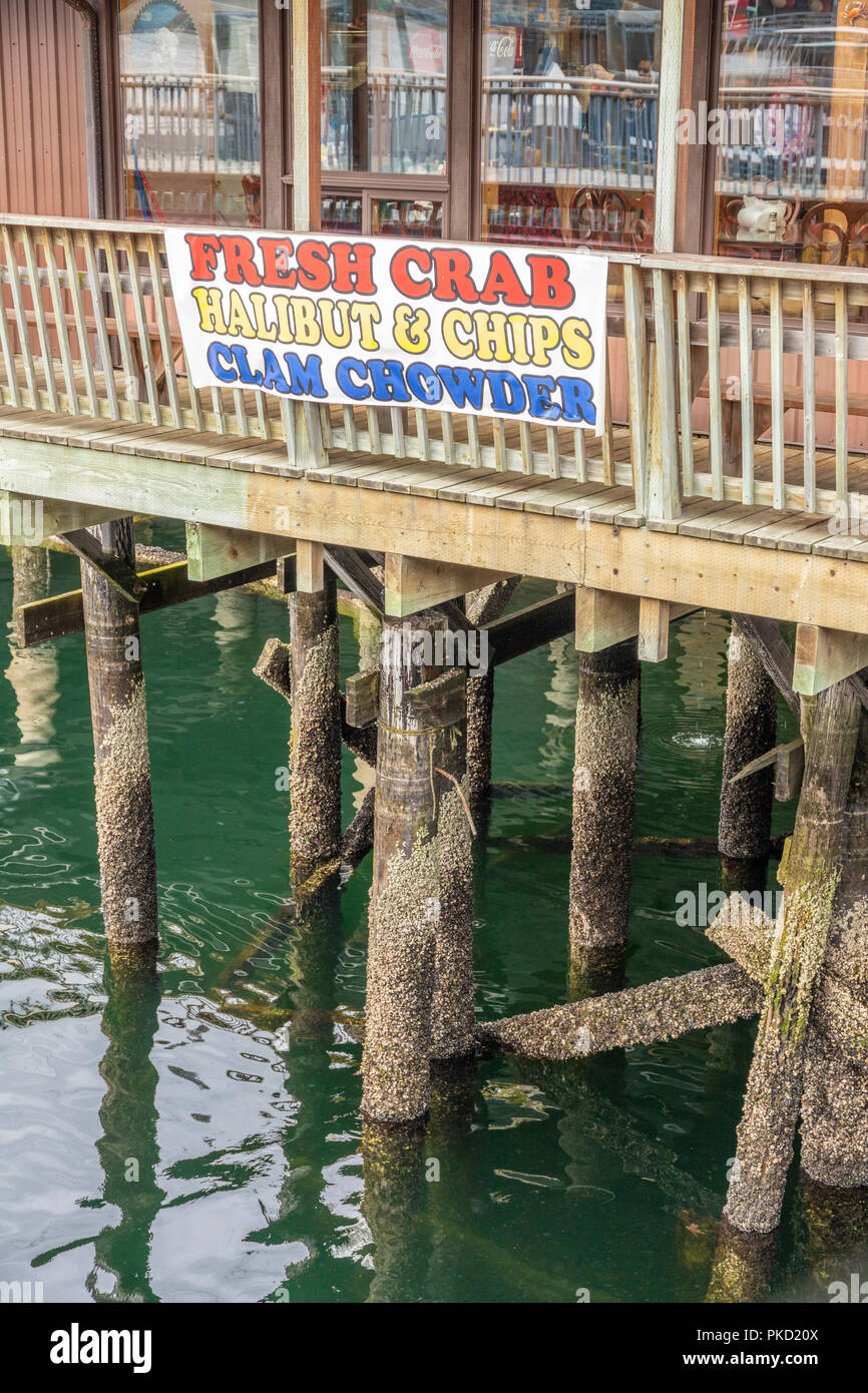 A restaurant on stilts in the harbour in Ketchikan, Alaska USA Stock Photo