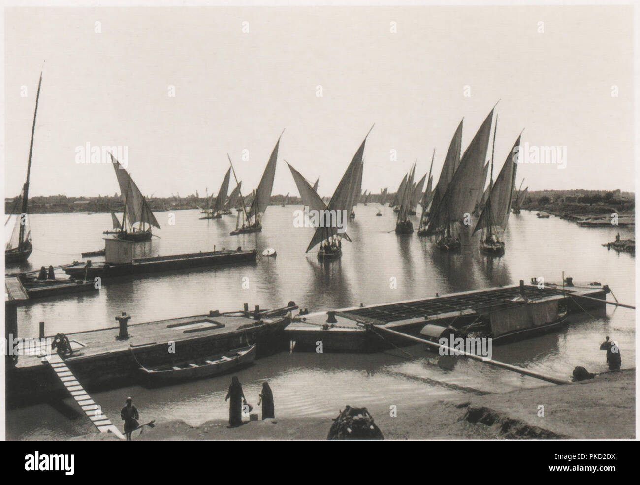 Vintage postcard showing Egyptian feluccas or dhows on the river Nile near Cairo circa 1929, photographed by the Austrian photographer Rudolf Lehnert Stock Photo