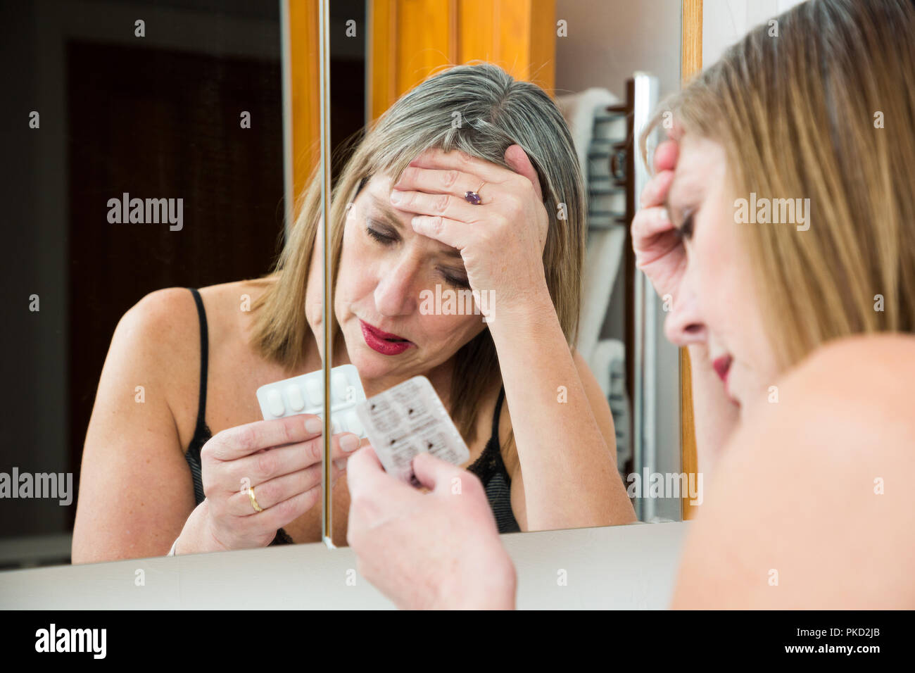 woman taking pills Stock Photo