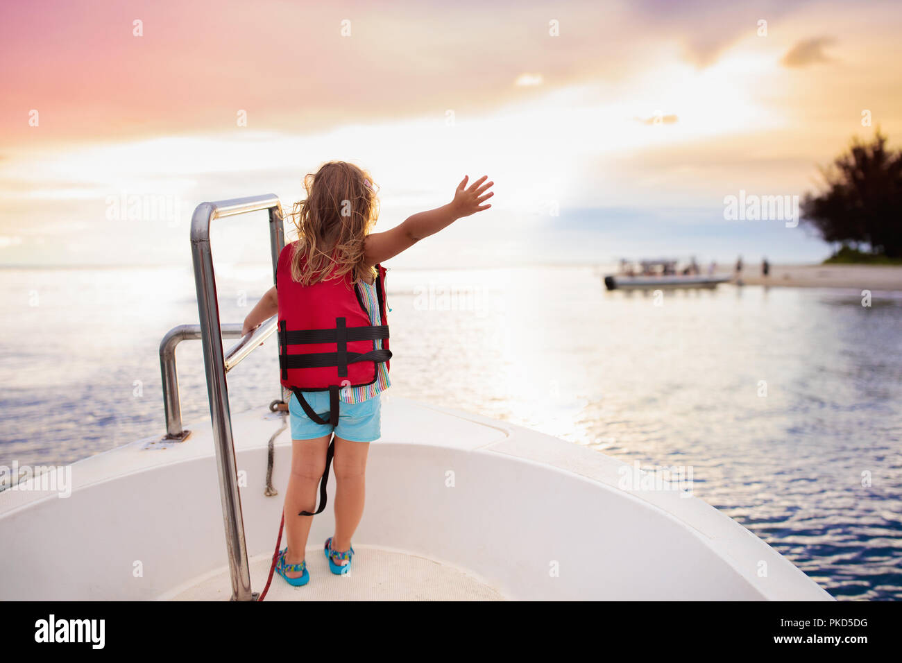 Kids sail on yacht in sea. Child sailing on boat. Little girl in safe