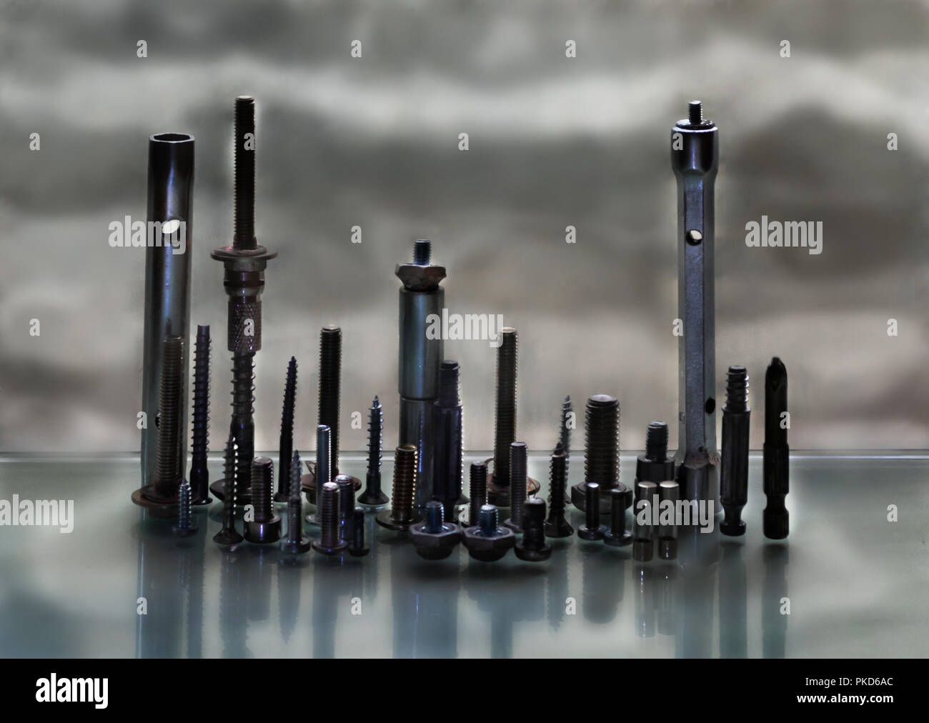 Varied tools, nuts, screws, nails. Varied tools representing a city on