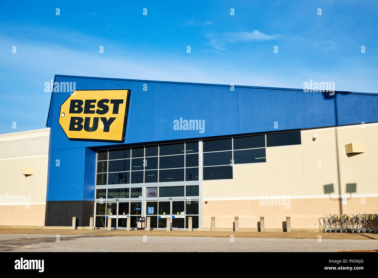 Best Buy front exterior entrance to the consumer electronics big box retail store with the corporate logo sign in Montgomery Alabama USA. Stock Photo