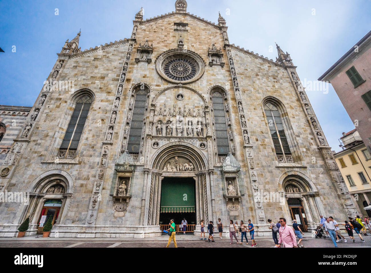 the imposing facade of Como Cathedral with prominent Rose Window, seen from Piazza del Duomo in Como, Lombary, Italy Stock Photo