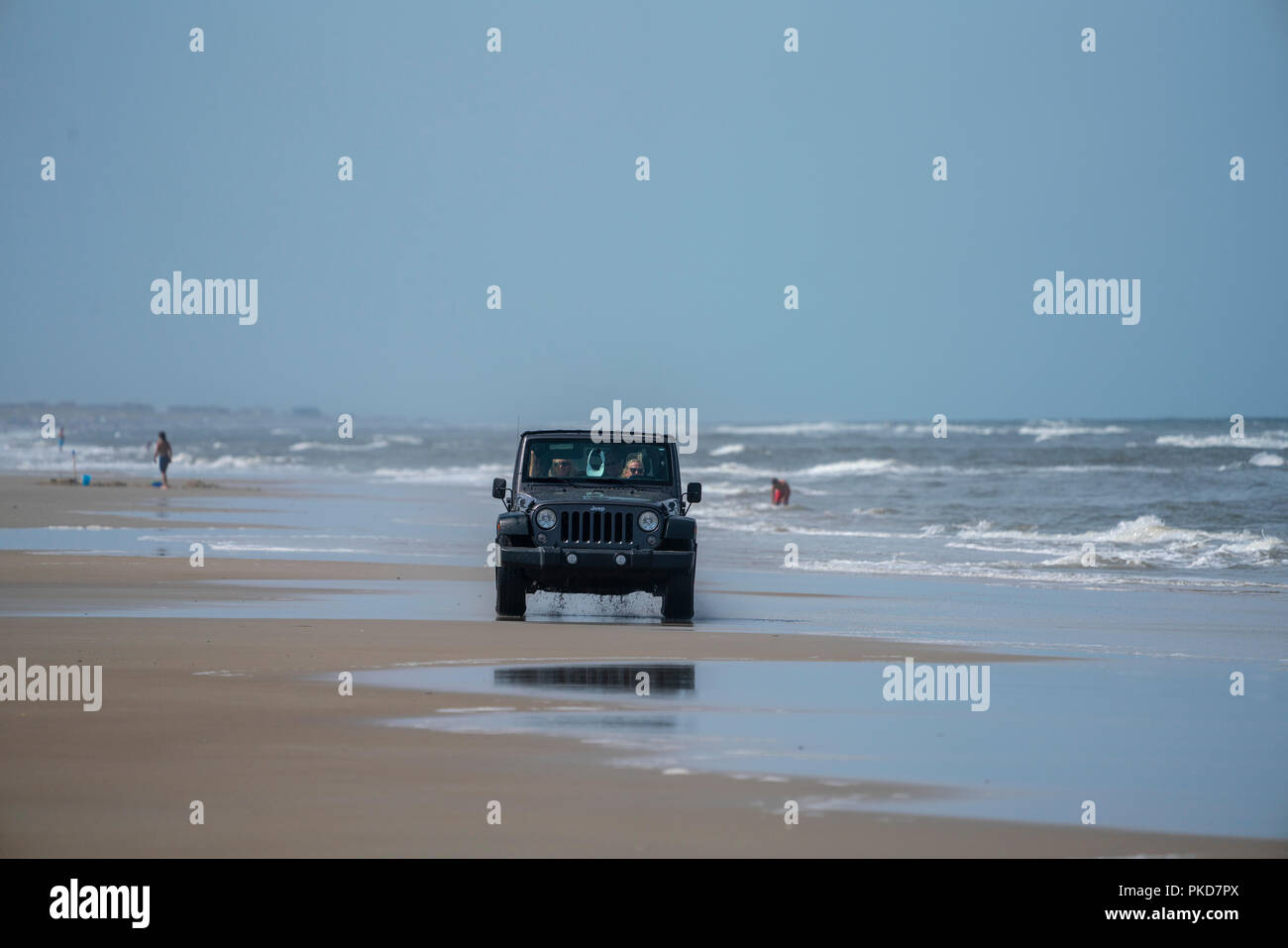 Jeep Wrangler driving on the Carova 4x4 section of beach in the Outer