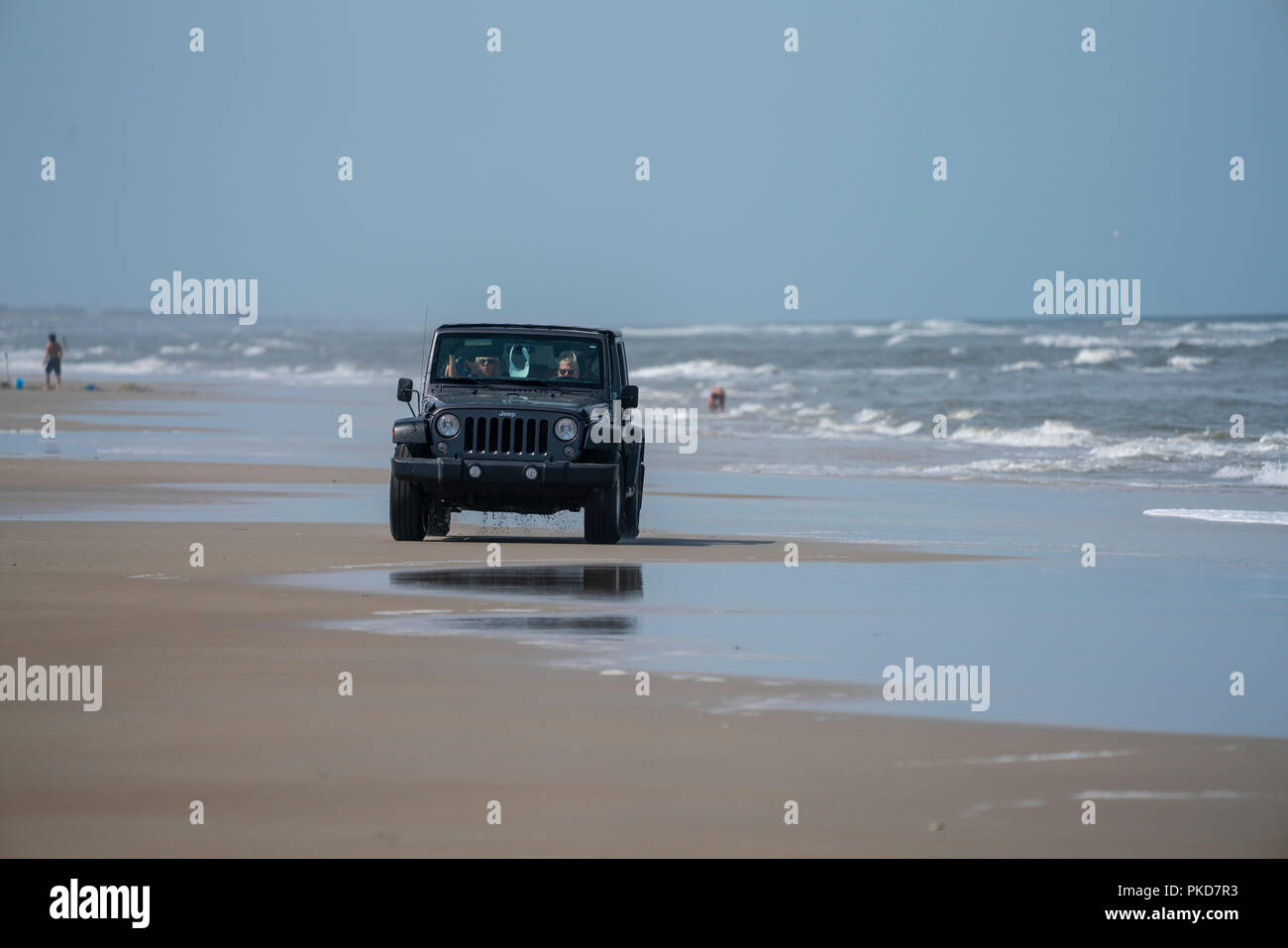 Jeep Wrangler driving on the Carova 4x4 section of beach in the Outer