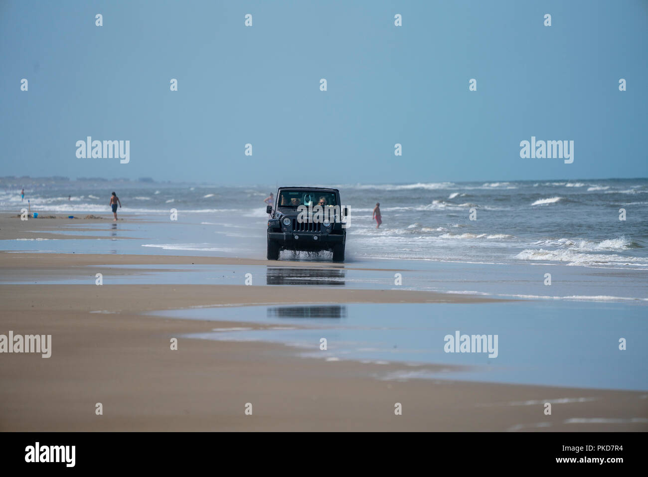 Jeep Wrangler driving on the Carova 4x4 section of beach in the Outer