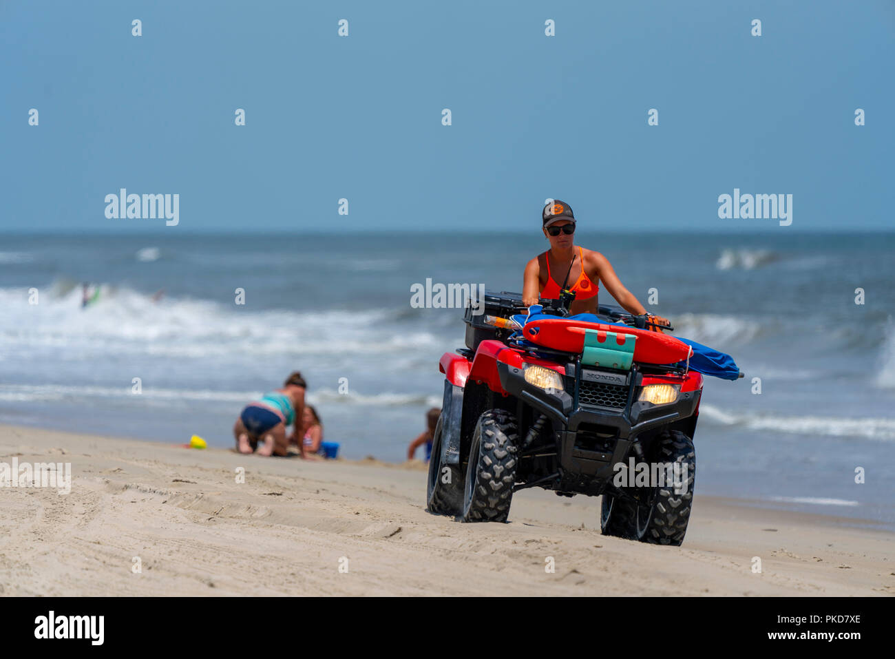 Lifeguard drives a ATV on the beach in Carova 4x4 section of beach in
