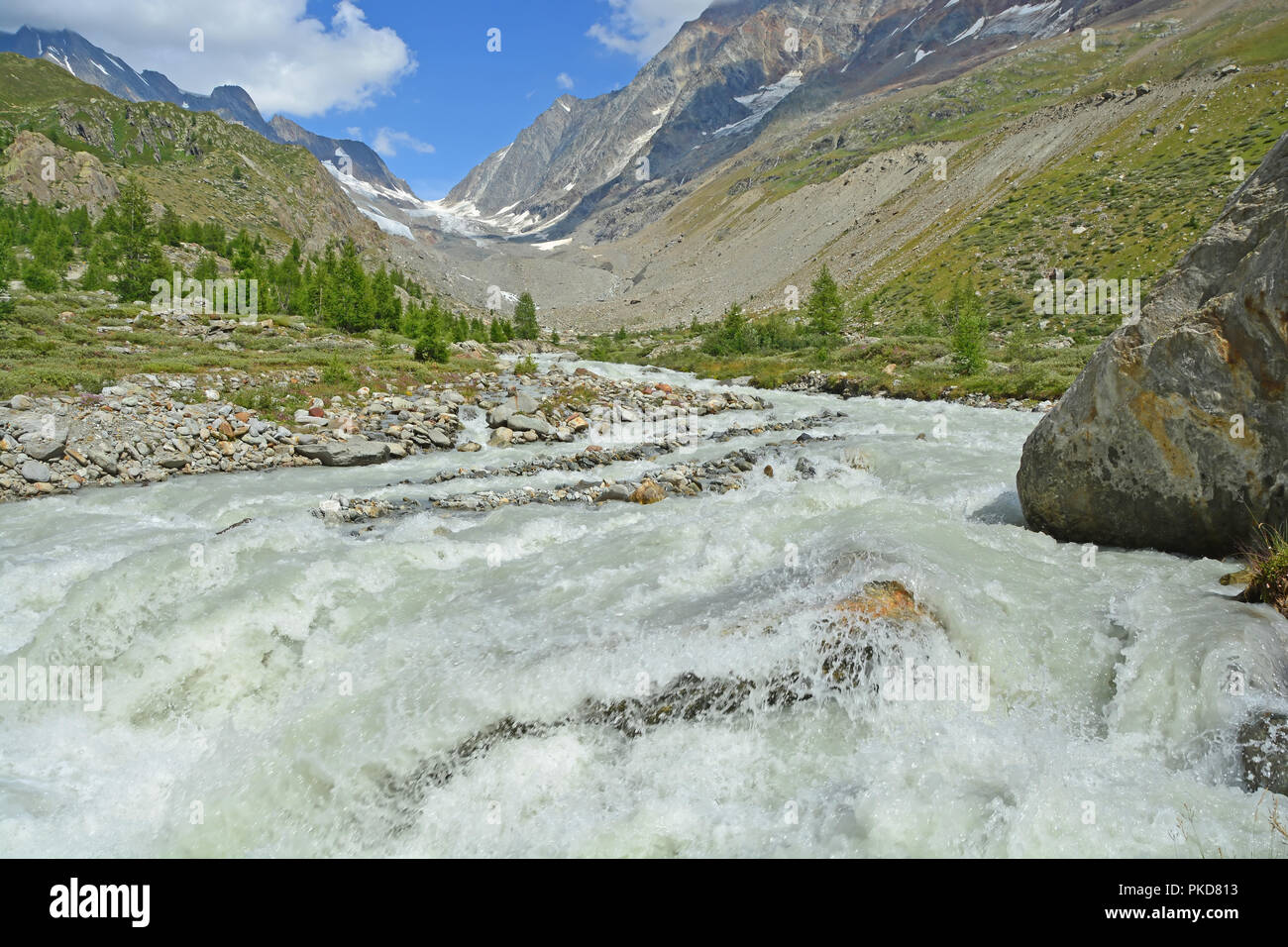 View up the Lochstal Valley and the Lonza glacial stream to the Lotschenlucke Pass in the Bernese Alps, Switzerland. Stock Photo