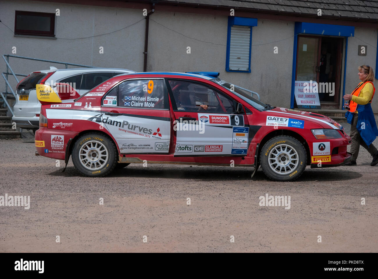 The Red and White Mitsubishi Evo 9 of Michael Binnie  Argyll Rally Dunoon 2018 right offside driver side view of red and white rally prepared two door Stock Photo