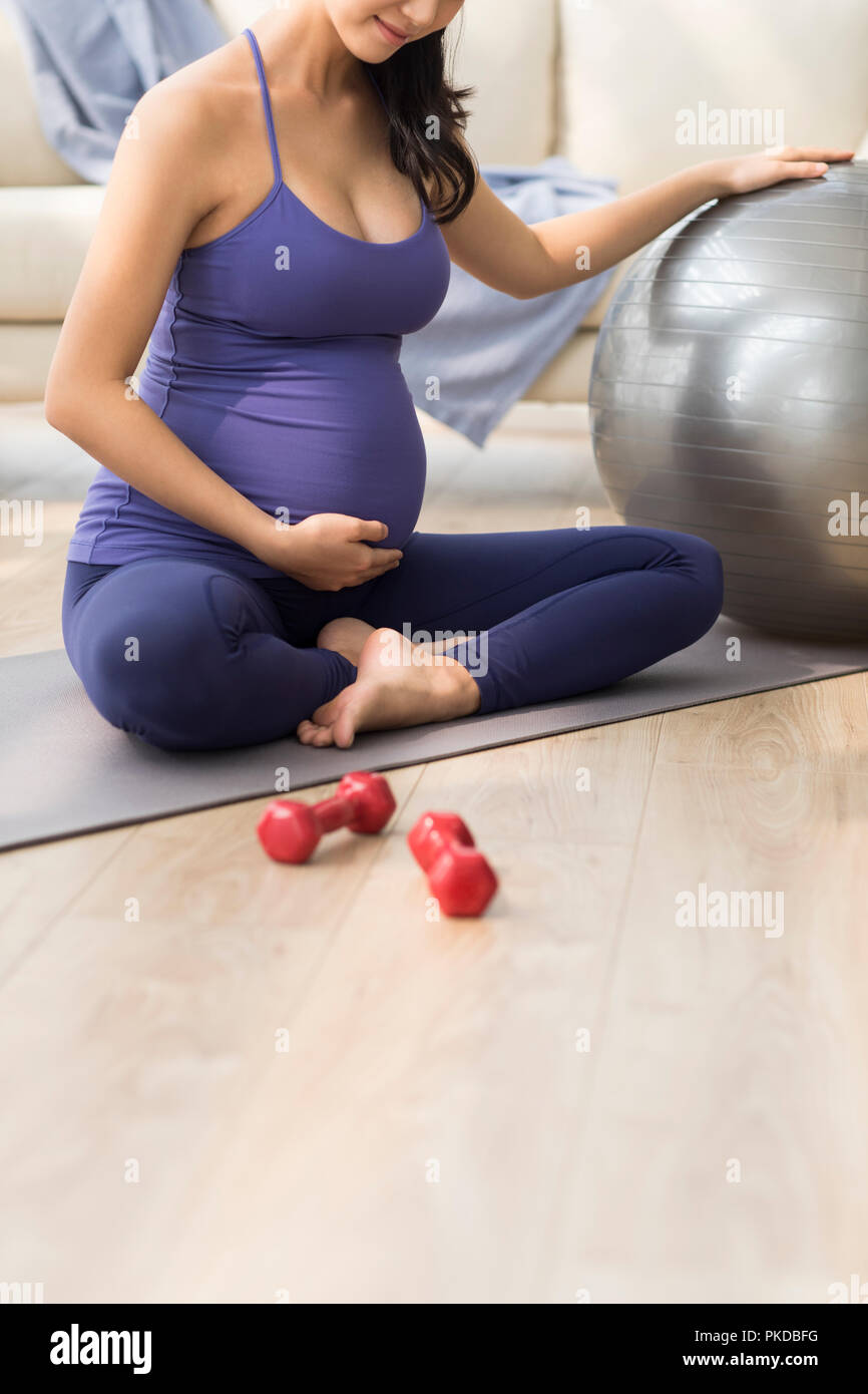 Pregnant woman touching belly Stock Photo Alamy