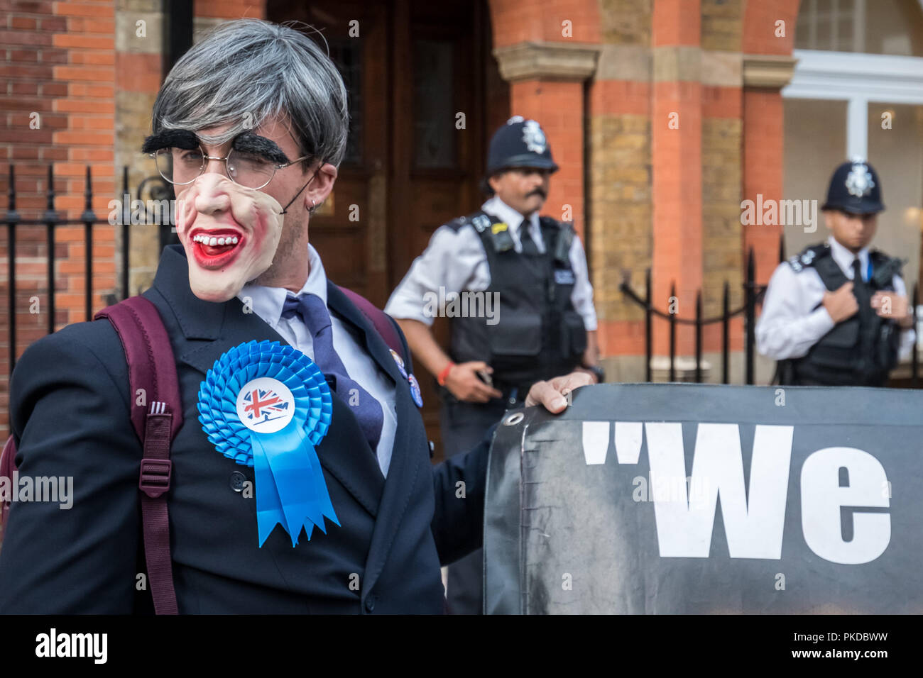 Jacob Rees-Mogg and his family are confronted by anti-capitalist protesters from Class War activist group outside his Westminster home. London, UK. Stock Photo