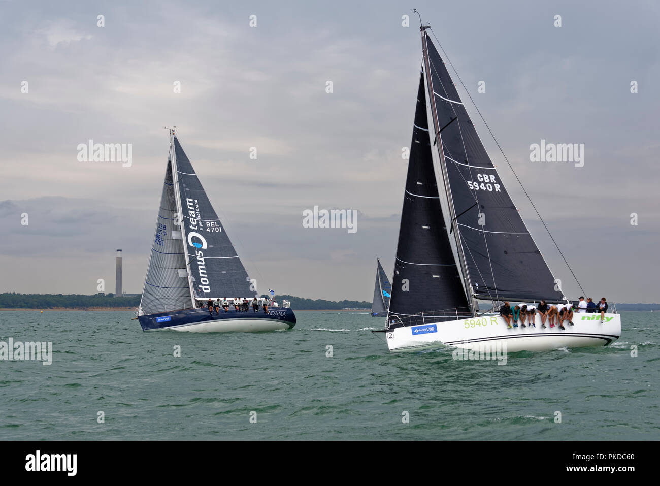 Close competition during the Cowes Week Regatta with these two yachts the Belgian Moana and British Nifty neck and neck in the Solent Stock Photo