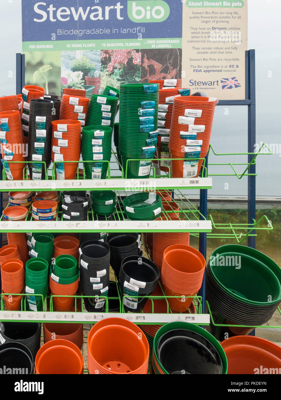A garden centre display  of eco friendly Stewart plant pots bio degradable in landfill after use Stock Photo